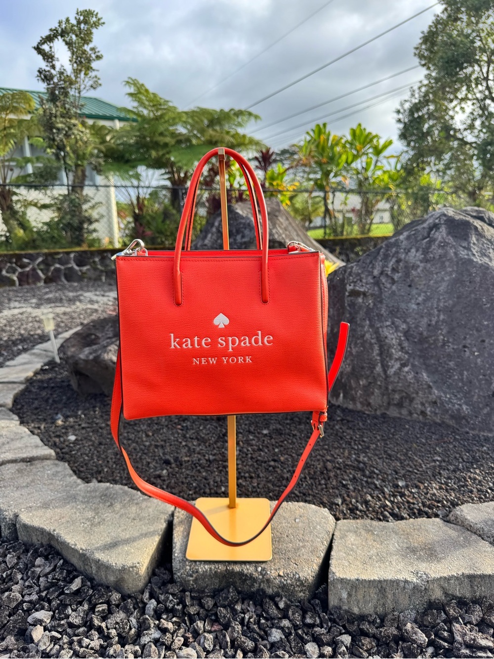 Description:
Bright red-orange Kate Spade New York structured tote featuring an